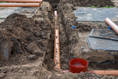 Sewer pipe installation in ground trench